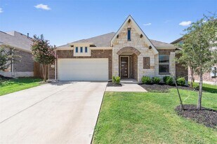 562 Leadtree Loop in Mustang Ridge, TX - Building Photo