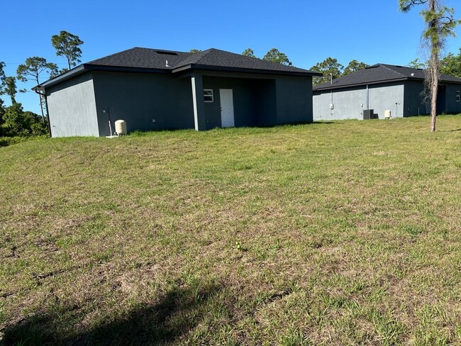 1221 Ecstasy St E in Lehigh Acres, FL - Building Photo - Building Photo