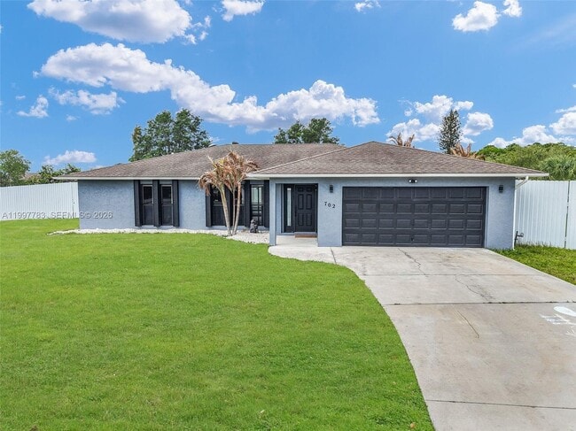 property at 702 NW Orchid St