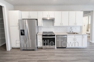 12983 W Ida Ave in Littleton, CO - Building Photo - Building Photo