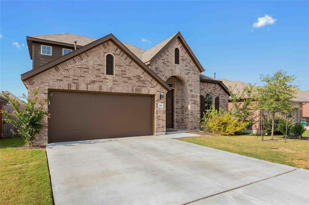 242 Oleander Loop in Mustang Ridge, TX - Building Photo