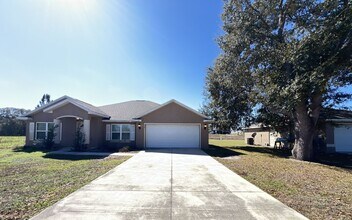 258 Malauka Run in Ocklawaha, FL - Building Photo - Building Photo