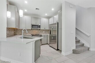 7501 Carnegie Way in Naples, FL - Building Photo - Building Photo