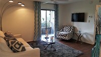 Living Room/ Patio Entry - Hidden Lake Apartments in Orlando, Florida