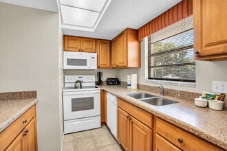 600 Neapolitan Way, Unit SI FL1-ID1073538P in Naples, FL - Building Photo - Building Photo