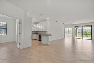 14107 Winding Cedar Wy in Miromar Lakes, FL - Building Photo - Building Photo