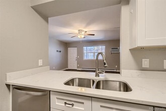 5873 S Prince St, Unit 103 in Littleton, CO - Building Photo - Building Photo
