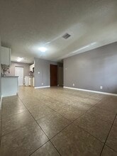 205 NW 15th St, Unit 203 in Belle Glade, FL - Foto de edificio - Building Photo