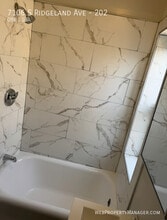 7106 S Ridgeland Ave in Chicago, IL - Building Photo - Building Photo