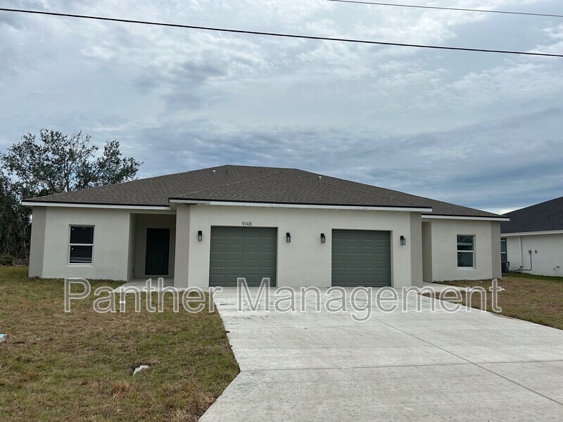 9150 Agate St in Port Charlotte, FL - Building Photo