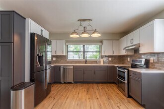 1713 Whispering Dr E in Largo, FL - Building Photo - Building Photo
