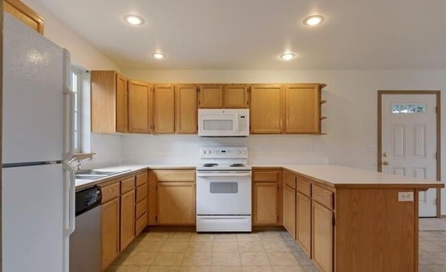 Bright Everett Home with 2-Car Garage in Everett, WA - Building Photo - Building Photo