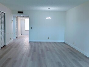 16491 Blatt Blvd-Unit -203 in Weston, FL - Building Photo - Building Photo
