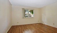 Spacious bedrooms with wood plank flooring - Mariners Cove Apartamentos in San Diego, California