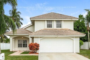 8640 Rosalie Ct in Boynton Beach, FL - Building Photo