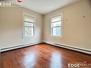 19 Claymoss Rd, Unit 3 in Boston, MA - Foto de edificio - Building Photo