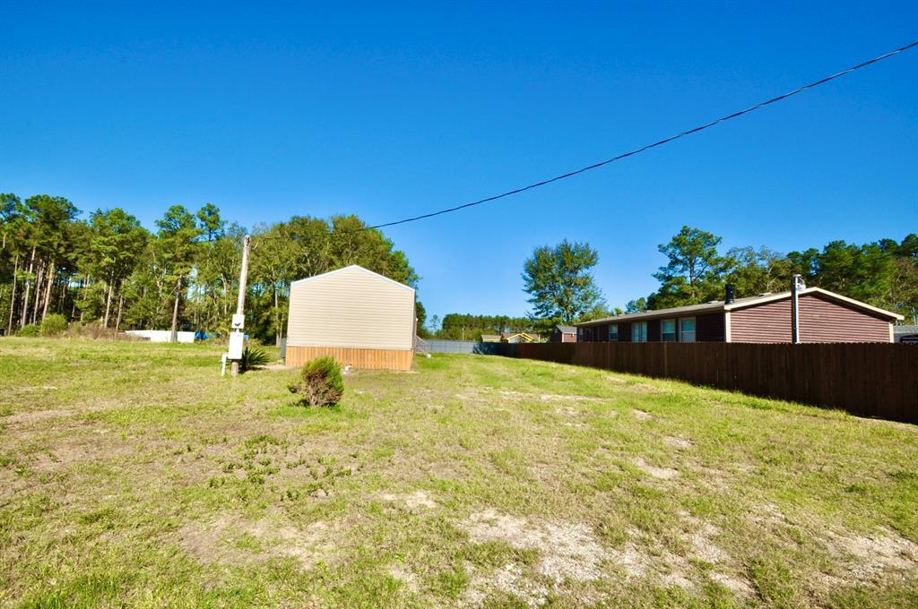 318 Rd 51023 in Cleveland, TX - Building Photo