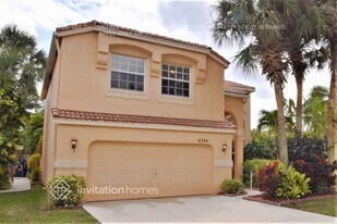 6334 Stonehurst Cir in Greenacres, FL - Building Photo