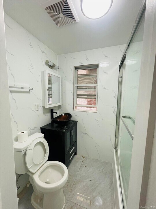 50-52-52 48th St in Queens, NY - Building Photo