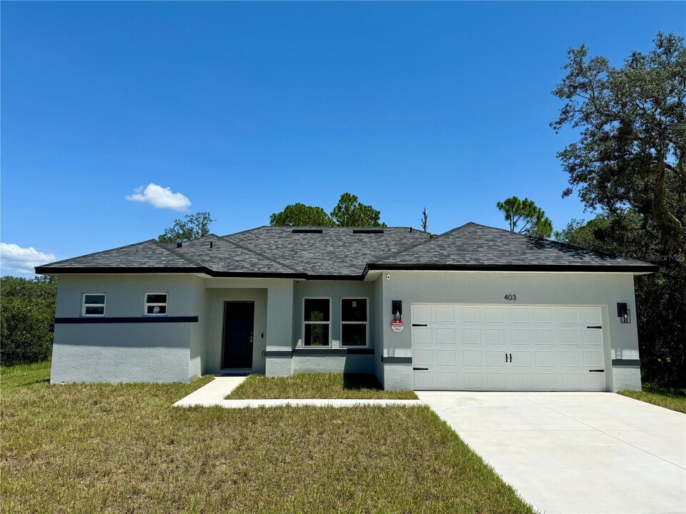 403 Caribbean Ct in Poinciana, FL - Foto de edificio