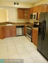 9033 Wiles Rd in Coral Springs, FL - Building Photo - Building Photo