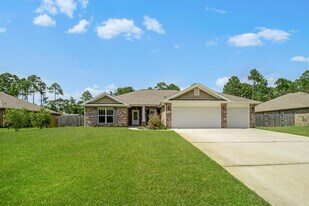 8748 Estrada St in Navarre, FL - Building Photo