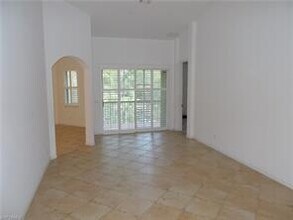 1425 Mariposa Cir-Unit -203 in Naples, FL - Building Photo - Building Photo