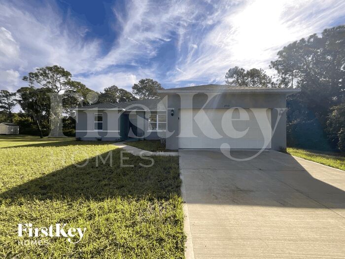 2703 Flintstone Ave SE in Palm Bay, FL - Foto de edificio