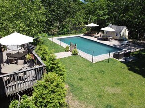 28 Old Trail Rd in Water Mill, NY - Building Photo - Building Photo