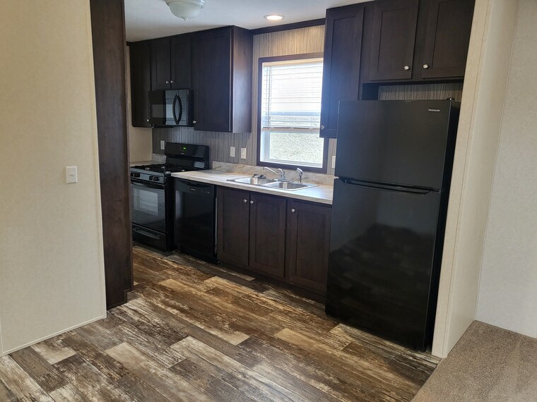 256 Spruce in Highland, MI - Building Photo