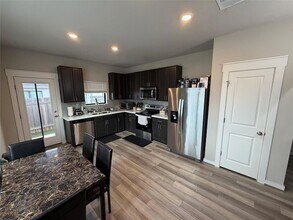 125 Threshing Rd, Unit A in Mustang Ridge, TX - Building Photo - Building Photo