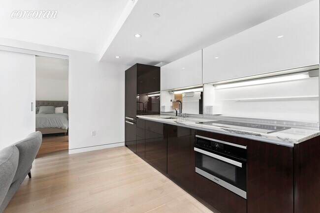 135 W 52nd St-Unit -: 15F in New York, NY - Building Photo - Building Photo