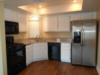 Kitchen with all appliances - Crown Point Apartments in Riverside, California