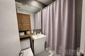 Spacious 3-Bedroom Residence Near Maria Hernandez Park, Unit 2L in Brooklyn, NY - Building Photo - Building Photo