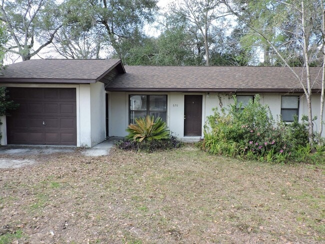 property at 670 SW Cardinal Dr