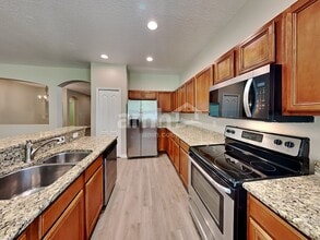 7729 Grasmere Dr in Land O Lakes, FL - Building Photo - Building Photo