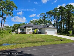 561 Harrisburg St SW in Palm Bay, FL - Building Photo - Building Photo
