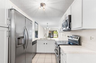 9676 W McNab Rd, Unit 110 in Tamarac, FL - Building Photo - Building Photo