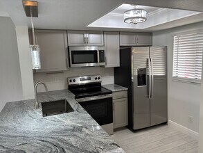 1704 University Ln, Unit College Club Condominium in Cocoa, FL - Building Photo - Building Photo
